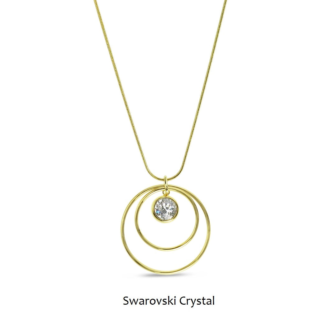 Gold tone necklace with two concentric metal circles and a single sparkling crystal drop in the centre on a snake chain