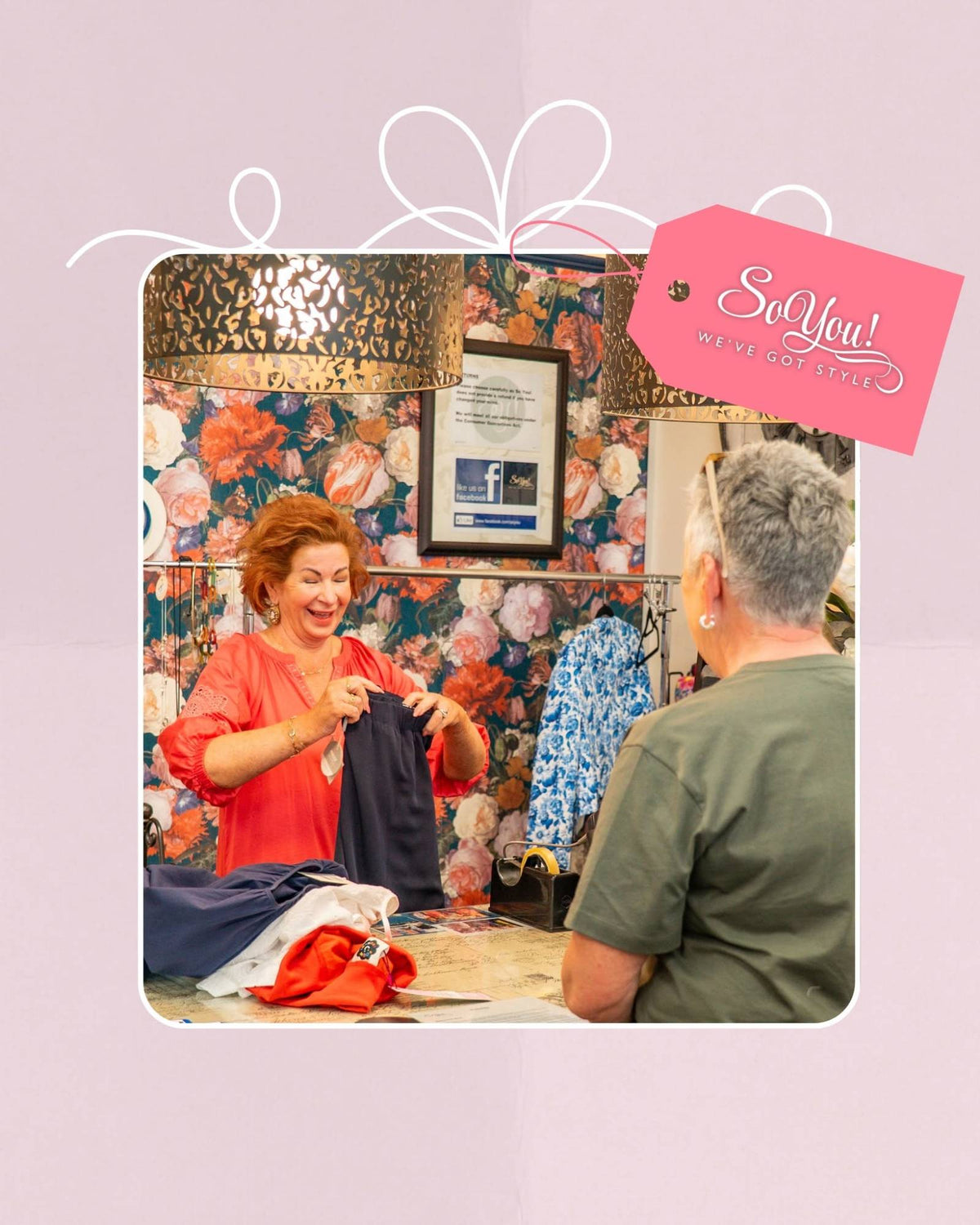 Debbie wrapping a customer's purchase at the So You! counter, with a pink So You! gift tag