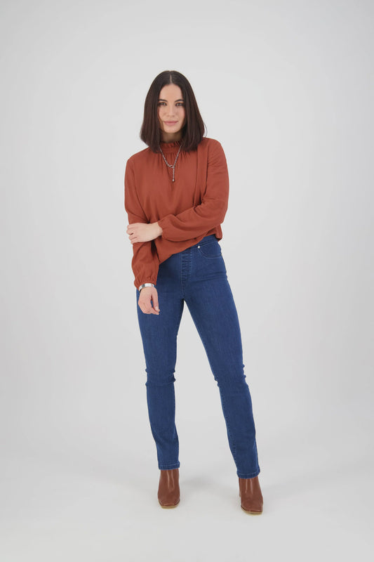 Vassalli high rise slim leg pull-on jeans in indigo blue stretch denim with silver-riveted faux front pockets and wash detail