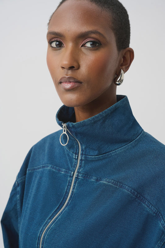 Boxy denim bomber jacket with funnel collar, metal centre-front zipper, dolman sleeves, and ribbed cuffs and hem