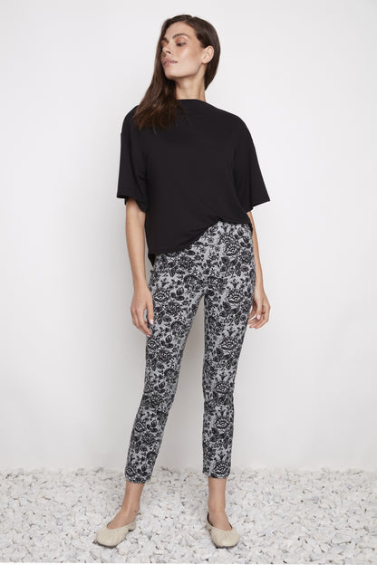 Ankle-length straight-leg pull-on pants in a techno lacy print in cool tones, shown from the front