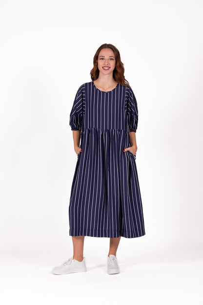 Navy dress with fine linear detail, balloon sleeves, a relaxed fit and a floaty skirt