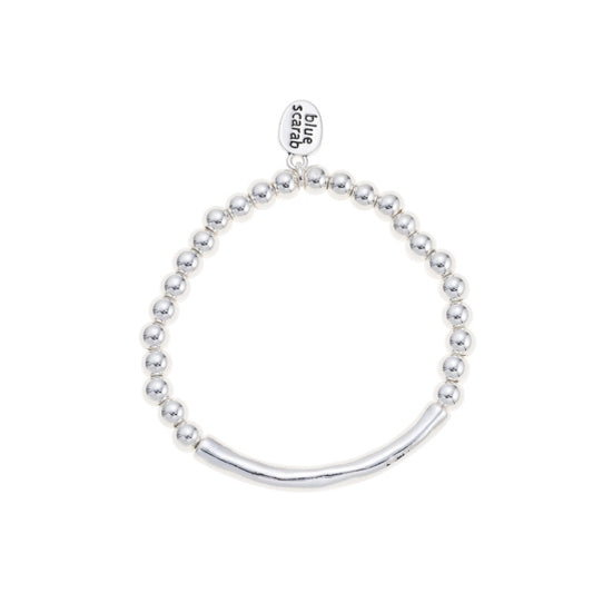 Slim silver Lotus bracelet by Blue Scarab with a sleek, minimalist design and a flexible elastic band