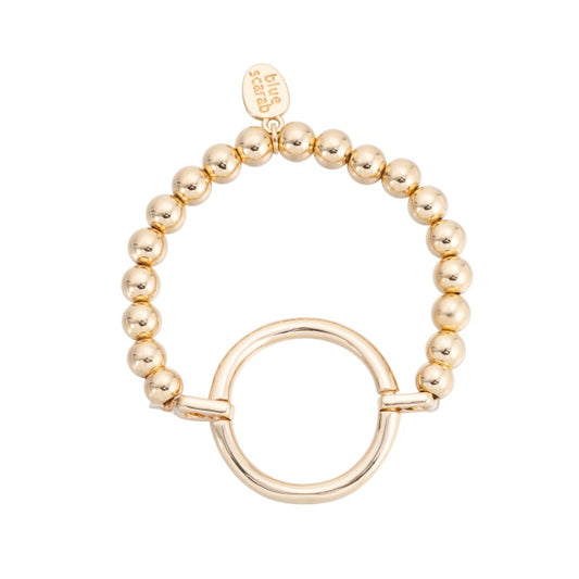 Stretch bead bracelet by Blue Scarab with one large open circle feature, worn on the wrist
