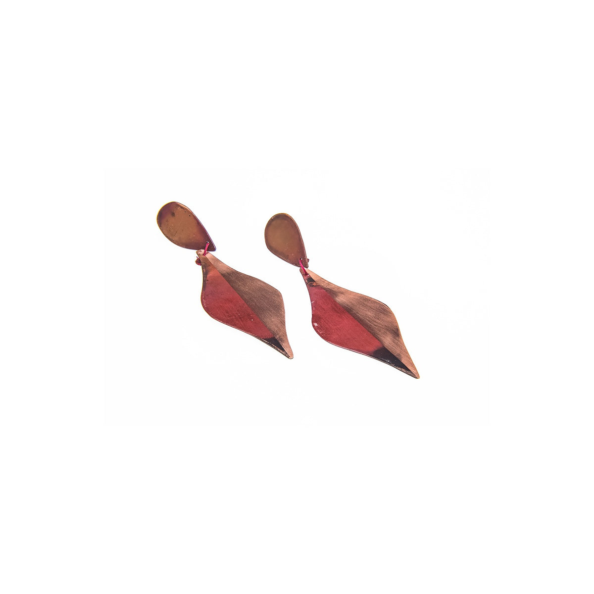 Pair of long copper-toned leaf drop earrings with a red and pink patina, hanging from simple ear hooks