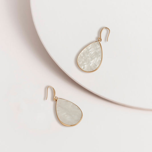 Cream acetate teardrop hook earrings with plated metal hooks, shown as a pair