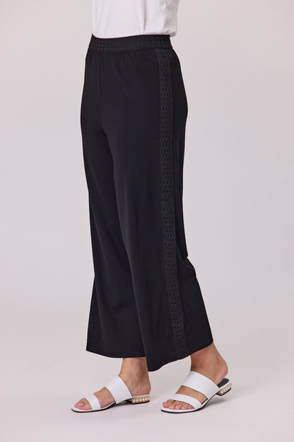 Black 7/8 length palazzo pants with wide legs, a square-effect elasticated waistband and a side trim detail