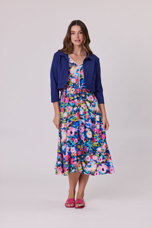 Cobalt blue cropped jacket with three-quarter sleeves, worn open, styled over a fitted outfit