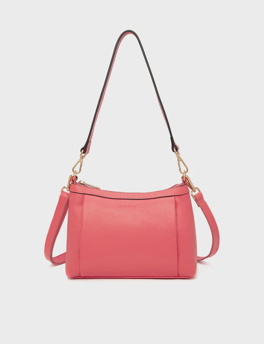 Compact leather crossbody bag with brushed gold fittings, shown with a plain front and a removable shoulder strap