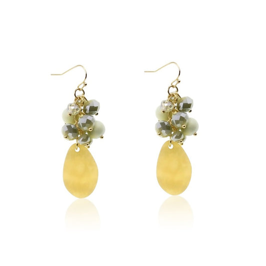 Pair of golden drop earrings with faceted glass and mixed beads linked together, hanging from fishhook fittings