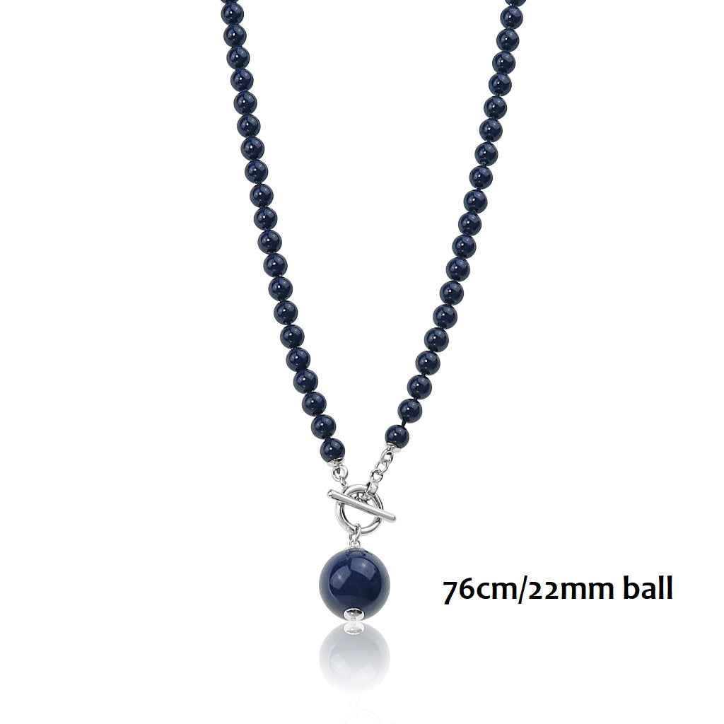 Long navy glass bead necklace with a larger bead drop and a silver ring and toggle closure at the front