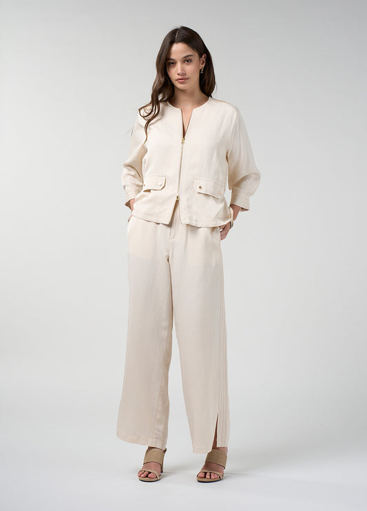 Lightweight ruched linen blend jacket in bone with front pockets and an adjustable waist, shown on a model