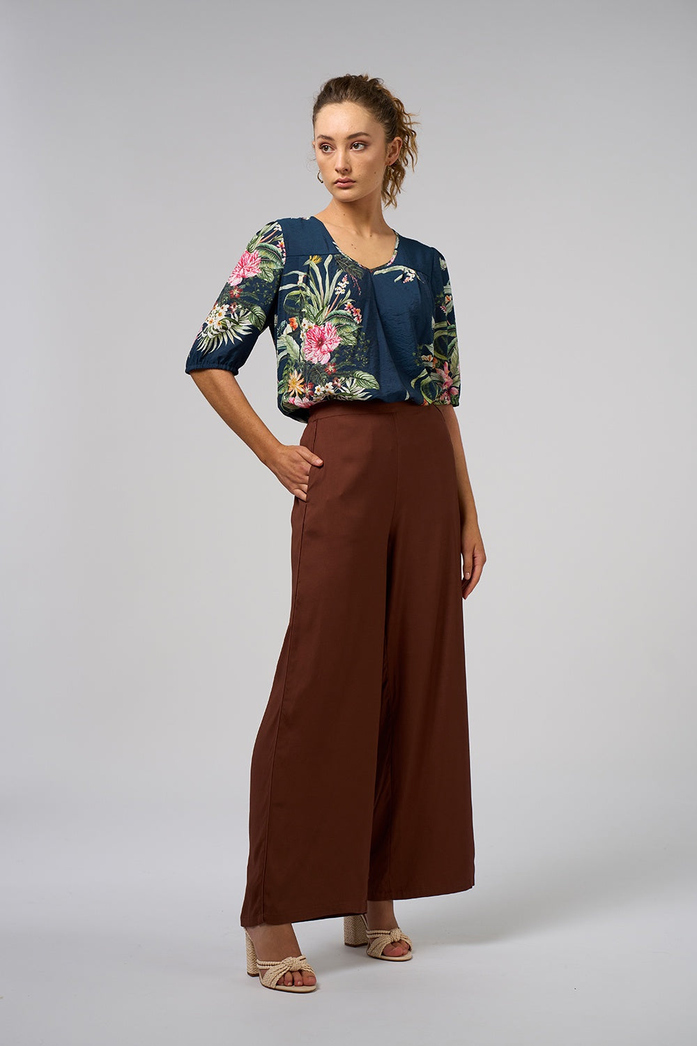 Espresso brown wide-leg sateen pull-on pants with a mid-rise waist, forward seams, piping and side pockets