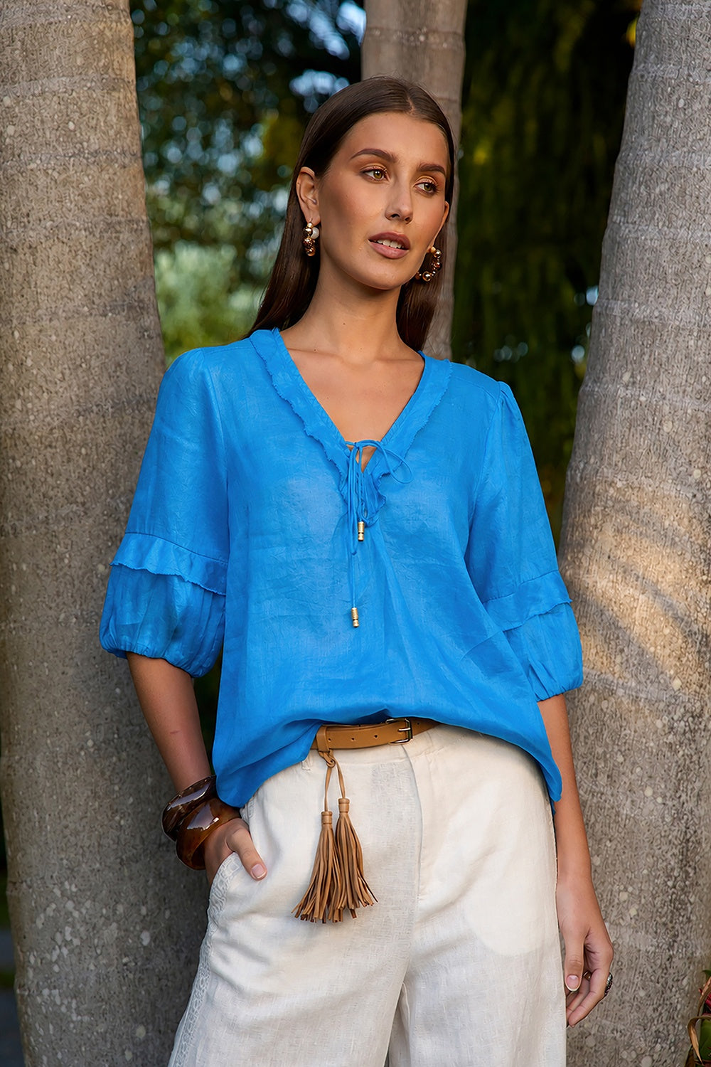 Romantic ramie blouse with deep V-neckline, tie detail, short blouson sleeves and elasticated cuffs