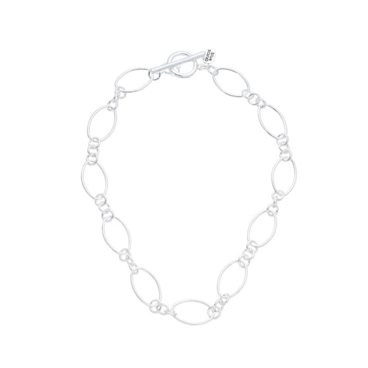 Silver oval link necklace with a fob closure, showing intricately designed links that catch the light
