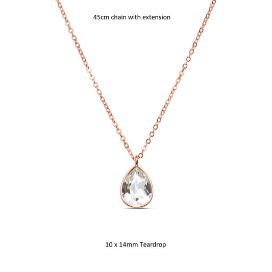 Rose gold necklace with a teardrop-shaped Swarovski crystal pendant hanging from a fine chain