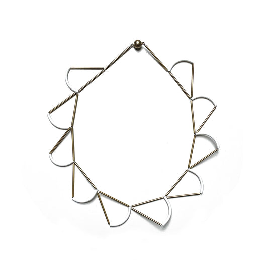 Short Mingk necklace with flat white semicircle shapes linked by gold tubes