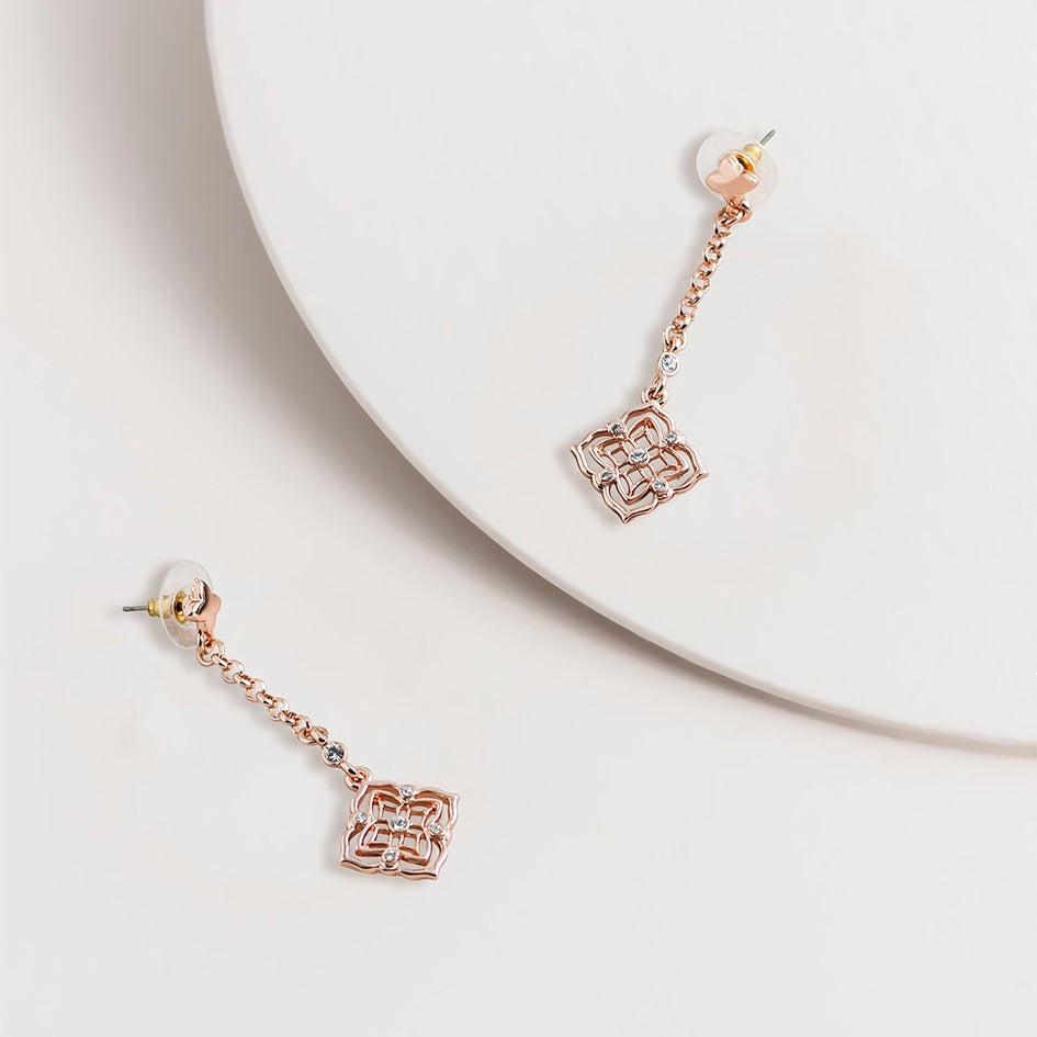 Silver filigree drop earrings with crystal drops, shown as post earrings with a delicate, lacy metal design