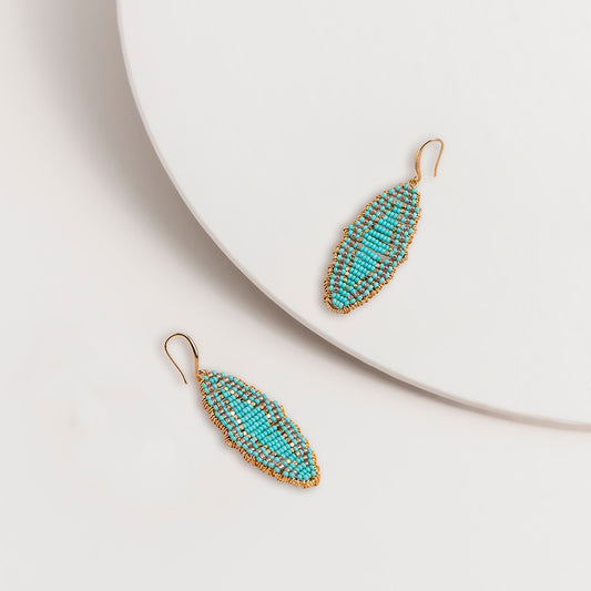 Turquoise seed bead hook earrings with gold edging, shown as a pair, 7 centimetres long