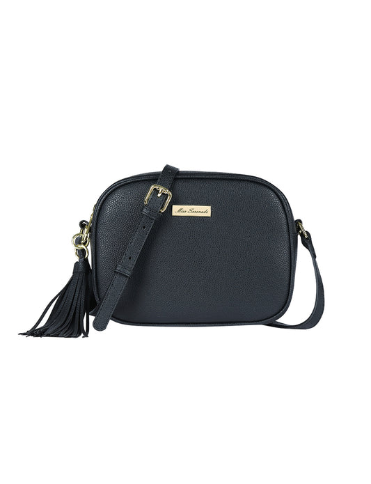 Vegan leather cross body bag with gold toned fittings, a tassel charm and an adjustable shoulder strap
