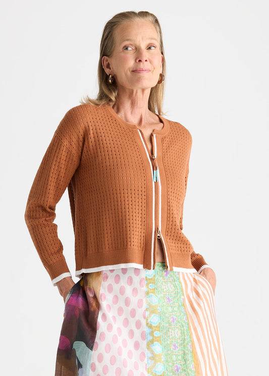 Lightweight pointelle zip cardigan in white with contrasting cuffs, refined front placket and a stylish hemline