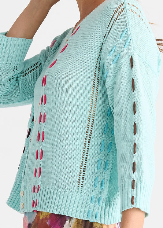 Button-front cotton knit top with vertical threaded lines down the front and sleeves and contrast blanket stitching