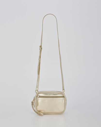Silver and champagne metallic leather bag with a contrasting front zip, gold hardware and an adjustable strap