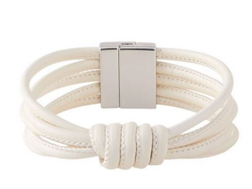 Knotted bracelet with a series of elegant intertwining knots and a magnetic closure, shown as a fashion accessory
