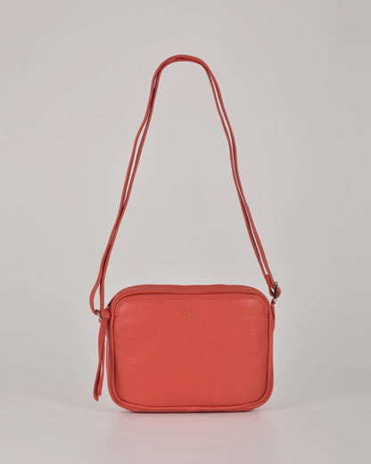 Darcy leather camera bag by Gabee with silver hardware, top zip, exterior slip pockets and an adjustable buckle strap