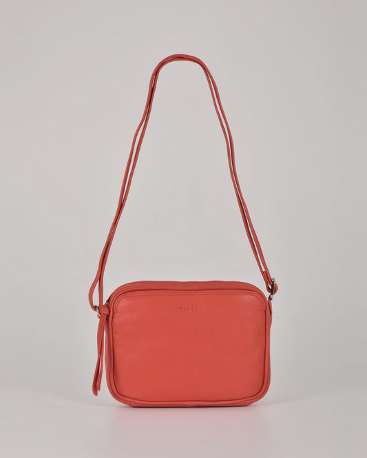 Darcy leather camera bag by Gabee with silver hardware, top zip, exterior slip pockets and an adjustable buckle strap