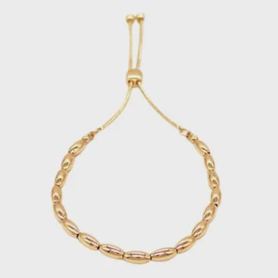 Delicate bracelet of oval metal beads on a slider chain with an adjustable slider fastening