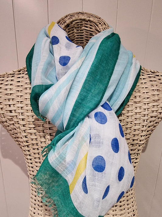 Lightweight green patterned scarf with a raw edge detail