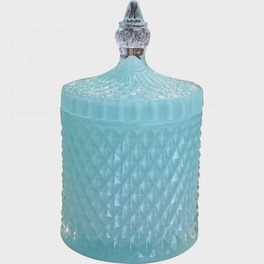Large tinted glass trinket case with a vintage pattern and a pointed arched lift-off lid, shown as a dresser accessory
