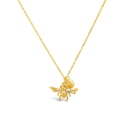Gold bee necklace with a small bee pendant hanging from a fine gold chain