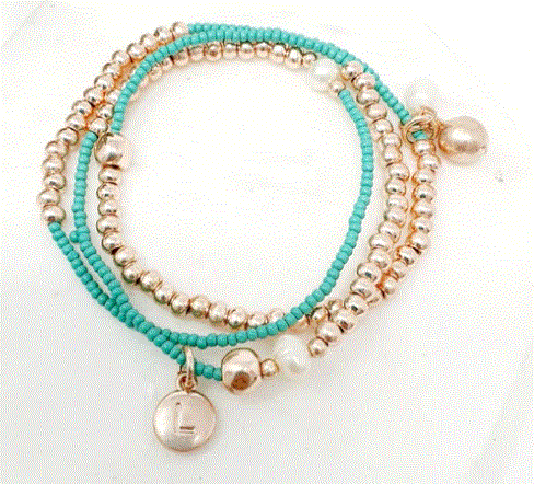 Stretchy turquoise and rose gold wrap-around bracelet with a shiny rose gold plated finish and a small pendant