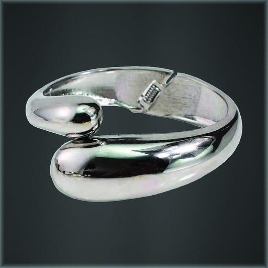 Teary Wrap Bangle by Avenue, a wrap-style metal bangle shown in silver and gold finishes