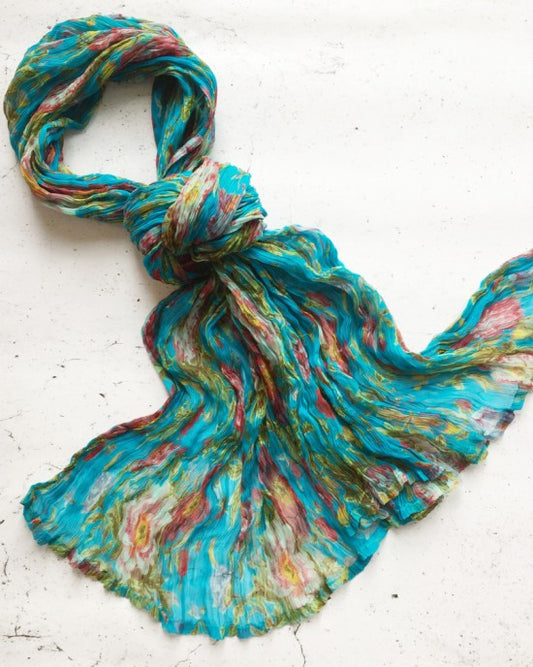 Floral cotton voile scarf with a crinkle finish and hand-printed spring bloom print, shown in turquoise and lime colourways