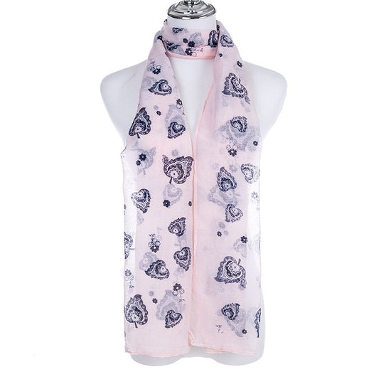 Pastel print scarf in pale pink and soft teal, long rectangular shape, laid out to show the soft colour print